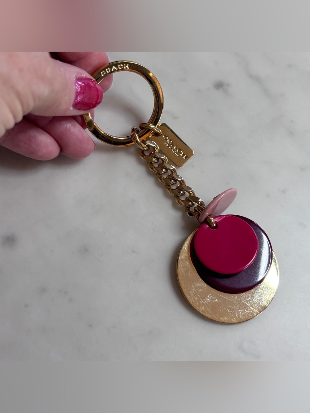 Coach Gold-Tone Keychain with Pink and Burgundy Disc Charms